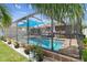 Backyard swimming pool surrounded by a screened enclosure with plenty of space for outdoor enjoyment at 31244 Baclan Dr, Wesley Chapel, FL 33545