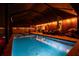 Outdoor pool and deck area perfect for evening entertaining with string lights at 31244 Baclan Dr, Wesley Chapel, FL 33545