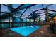 Beautiful in-ground pool and spa surrounded by a screened enclosure and brick pavers at 31244 Baclan Dr, Wesley Chapel, FL 33545