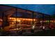 Outdoor pool and deck area perfect for evening entertaining with string lights at 31244 Baclan Dr, Wesley Chapel, FL 33545