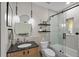 Modern bathroom featuring a vanity with a sink, a toilet, and a glass-enclosed shower at 325 5Th S Ave # 9, St Petersburg, FL 33701