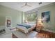 Cozy bedroom with hardwood floors, natural light, a ceiling fan, and a calming color palette at 325 5Th S Ave # 9, St Petersburg, FL 33701