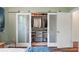 Custom walk-in closet with sliding glass doors, built-in shelving, and organized storage at 325 5Th S Ave # 9, St Petersburg, FL 33701