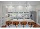 Modern kitchen featuring an island with bar seating, white cabinets, and stainless steel appliances at 325 5Th S Ave # 9, St Petersburg, FL 33701