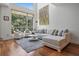 Bright living room with high ceilings, large windows, and a comfortable seating arrangement at 325 5Th S Ave # 9, St Petersburg, FL 33701