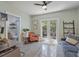 Cozy office with a desk, chair, and a view of the outdoors through French doors at 325 5Th S Ave # 9, St Petersburg, FL 33701