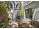 Cozy outdoor patio with seating area, lush greenery, decorative stone accents, and a private ambiance at 325 5Th S Ave # 9, St Petersburg, FL 33701
