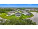 Wide aerial view of the home's location within a well-planned community, showcasing a large lake at 33668 Willow Point Ct, Wesley Chapel, FL 33545