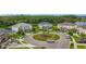 Aerial shot of a well-maintained home in a cul-de-sac with beautiful landscaping and neighborhood charm at 33668 Willow Point Ct, Wesley Chapel, FL 33545