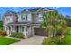 Beautiful home featuring a well-manicured lawn and mature landscaping that enhance its curb appeal at 33668 Willow Point Ct, Wesley Chapel, FL 33545