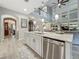 Open concept kitchen with island flows into the living room and features pendant lighting at 33668 Willow Point Ct, Wesley Chapel, FL 33545