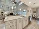 Spacious open concept kitchen with vaulted ceilings, large windows, white cabinets, and granite countertops at 33668 Willow Point Ct, Wesley Chapel, FL 33545