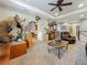 Elegant living room with coffered ceiling, comfortable seating, and stylish décor at 33668 Willow Point Ct, Wesley Chapel, FL 33545