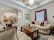 Spacious living room area featuring an archway to the dining room, neutral decor, and ample natural light at 33668 Willow Point Ct, Wesley Chapel, FL 33545