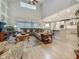 Expansive living room boasting hardwood floors, soaring ceilings, and an open layout to the kitchen at 33668 Willow Point Ct, Wesley Chapel, FL 33545