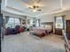 Generously sized main bedroom with two work desks and natural light at 33668 Willow Point Ct, Wesley Chapel, FL 33545