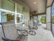 Enclosed patio with comfortable seating and views of outdoor space at 33668 Willow Point Ct, Wesley Chapel, FL 33545