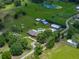 Expansive property featuring a well-maintained home, large barn, pool, and ample green space at 3412 Ace Ln, Dover, FL 33527