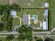Lovely aerial view of an estate featuring a pool, outbuildings, and long driveway at 3412 Ace Ln, Dover, FL 33527