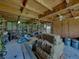 Open barn area with hay bales, and storage solutions perfect for farm equipment and supplies at 3412 Ace Ln, Dover, FL 33527