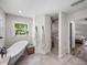 Spacious bathroom with stylish tile shower, freestanding tub, and linen closet at 3412 Ace Ln, Dover, FL 33527
