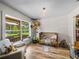 Charming bedroom with wood floors, large window, and adjacent closet at 3412 Ace Ln, Dover, FL 33527