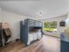 Cozy bedroom with a wood floor, bunk beds, and a window at 3412 Ace Ln, Dover, FL 33527