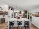 Bright kitchen with a large marble island, barstool seating, and modern appliances at 3412 Ace Ln, Dover, FL 33527