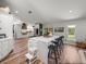 Open kitchen design with expansive island, bar seating, and stainless steel appliances at 3412 Ace Ln, Dover, FL 33527