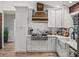 Well-equipped kitchen featuring stainless steel appliances, custom cabinetry, and wooden accents at 3412 Ace Ln, Dover, FL 33527