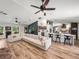 Open-concept living area showcasing the stylish bar and expansive sectional sofa at 3412 Ace Ln, Dover, FL 33527