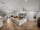 Bright living room features hardwood floors and open layout at 3412 Ace Ln, Dover, FL 33527
