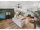 Open-concept living room boasts high ceilings and natural light at 3412 Ace Ln, Dover, FL 33527