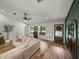 Cozy living area with wood floors and a rustic exterior door at 3412 Ace Ln, Dover, FL 33527