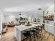Open-concept living space with kitchen island, bar, and comfortable seating areas at 3412 Ace Ln, Dover, FL 33527