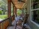 Spacious porch with rocking chairs to enjoy the quiet outdoor space at 3412 Ace Ln, Dover, FL 33527