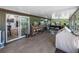 Bright sunroom featuring durable flooring, sliding glass doors to the kitchen, and an abundance of natural light at 3412 Ace Ln, Dover, FL 33527