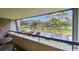 Relax on this balcony with a scenic view of the parking area and lush landscaping at 36750 Us 19 N # 09208, Palm Harbor, FL 34684