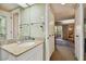 A bathroom vanity with a view of the bedroom and sliding doors in the mirror at 36750 Us 19 N # 09208, Palm Harbor, FL 34684