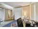 A bedroom with a murphy bed, printer, and a view of a patio area at 36750 Us 19 N # 09208, Palm Harbor, FL 34684