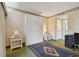 Comfortable bedroom showcasing a murphy bed, printer, and decorative carpet at 36750 Us 19 N # 09208, Palm Harbor, FL 34684