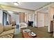 Spacious living room with ample seating, desk space, and seamless access to other living areas at 36750 Us 19 N # 09208, Palm Harbor, FL 34684