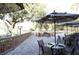 An outdoor patio space has a variety of seating areas that surrounds a fire pit at 36750 Us 19 N # 09208, Palm Harbor, FL 34684