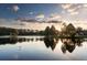 Tranquil water view with golden sunlight reflecting off the surface, showcasing the scenic beauty of Innisbrook at 36750 Us 19 N # 09208, Palm Harbor, FL 34684