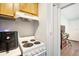 Compact kitchen featuring modern amenities with a view into the main room at 4130 Dolphin Dr, Tampa, FL 33617
