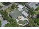 Aerial view of a charming single-Gathering home with a pool and lush greenery creating a private backyard oasis at 4206 W Palmira Ave, Tampa, FL 33629