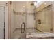 Bathroom highlighting the tiled glass shower with built in seat and granite trim at 4206 W Palmira Ave, Tampa, FL 33629