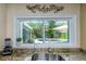 Kitchen sink with granite countertop overlooking a lush, private backyard and pool at 4206 W Palmira Ave, Tampa, FL 33629