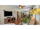 Spacious living room with hardwood floors and open layout, complete with a large mirror wall at 4206 W Palmira Ave, Tampa, FL 33629
