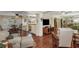 Open-concept living space with hardwood floors, seamlessly connects to the dining area and kitchen at 4206 W Palmira Ave, Tampa, FL 33629